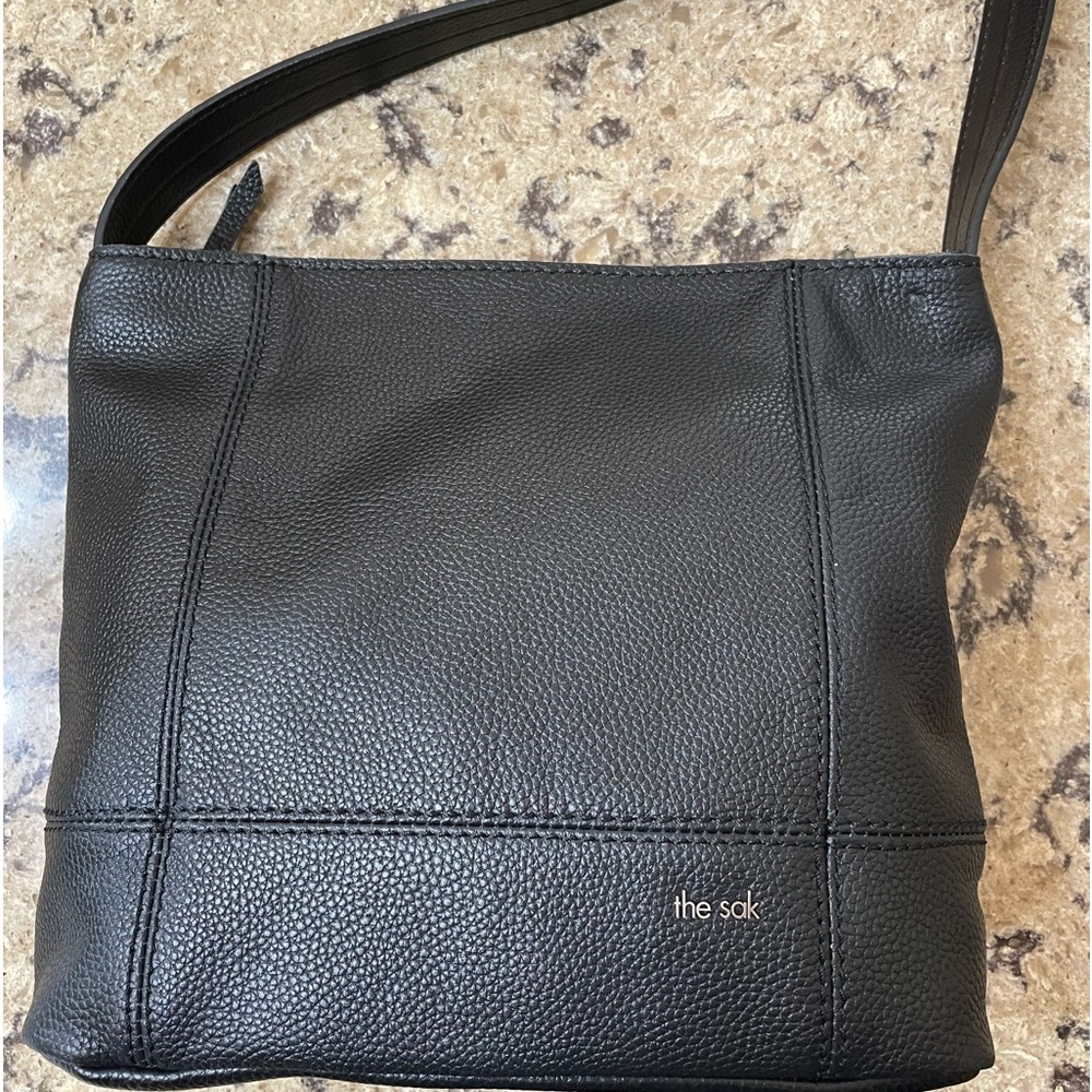 the Sak black pebble grain leather hobo bag.